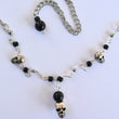 Swirling Skulls Necklace